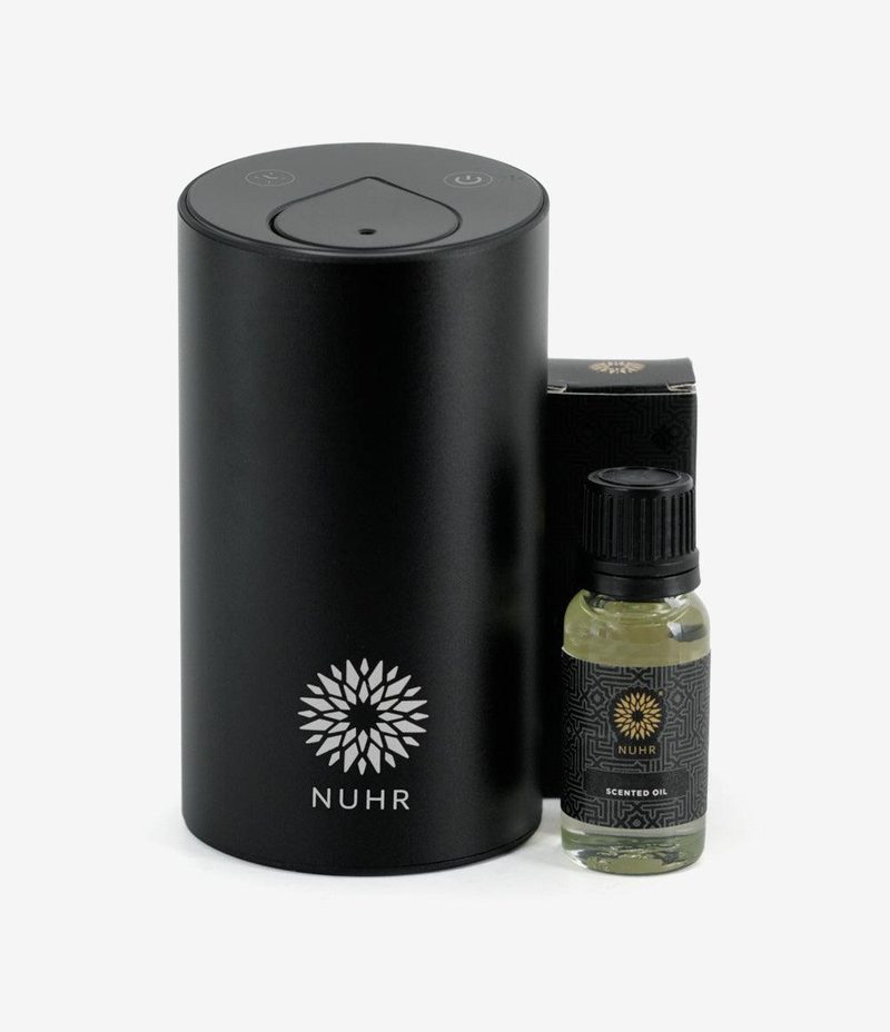 NUHR black mini electric diffuser with a bottle of scented oil